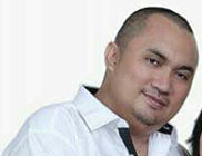 Roli Mangunsong, SE.